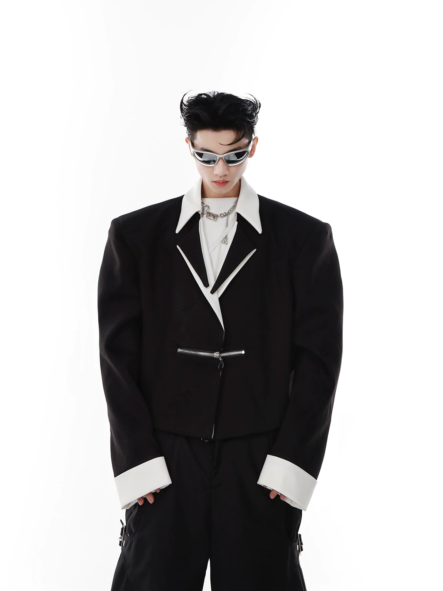 CulturE is a niche deconstructed black and white contrasting padded shoulder cropped blazer with a metal zipper