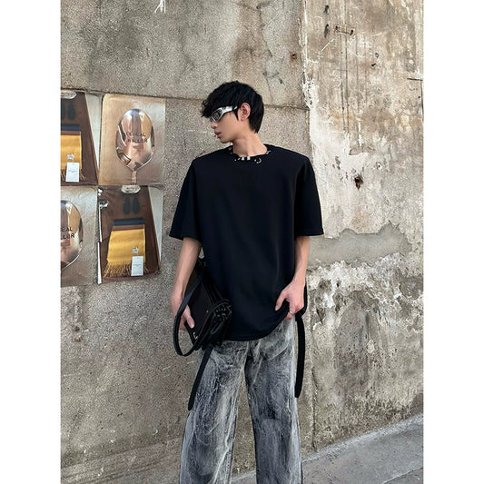 MARTHENAUT IS A NICHE DESIGN SILHOUETTE WITH PADDED SHOULDERS AND METALLIC EMBELLISHMENTS, A SUMMER T-SHIRT IN SOLID COLORS, AND A VERSATILE SHORT-SLEEVED TOP