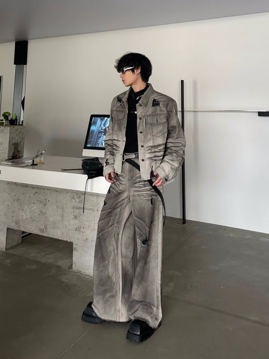 MARTHENAUT'S NICHE ORIGINAL DESIGN IS A DECONSTRUCTED TOP JEANS SET IN GREY WITH A DISTRESSED TWO-PIECE