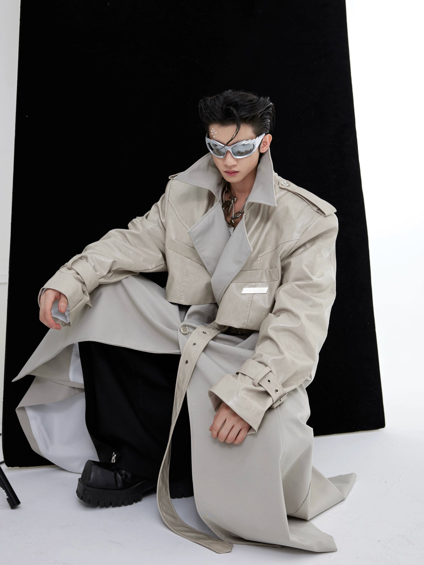 Cultur E24s is a heavyweight, niche deconstructed double-panelled padded-shoulder maxi coat with a breasted trench coat